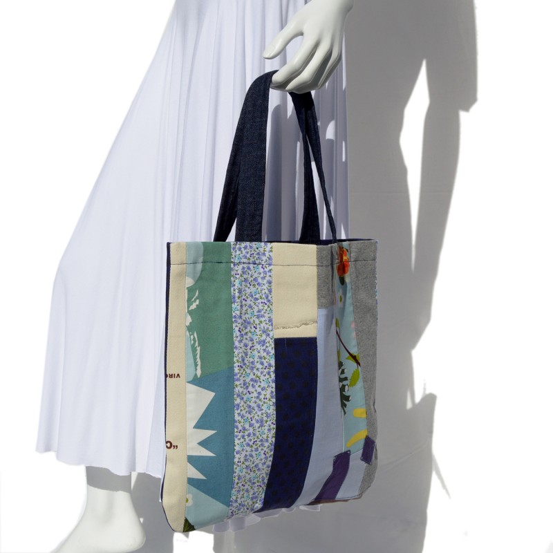 Long fluid white cotton skirt and patchwork bag