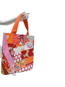 Bag made in Patchwork in bright shades of red, orange and pink