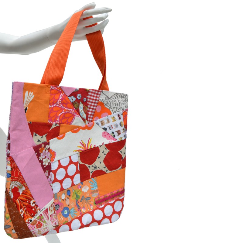 Bag made in Patchwork in bright shades of red, orange and pink