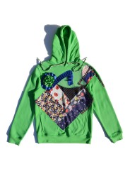 Sudadera verde con frontal de patchwork y transparencias